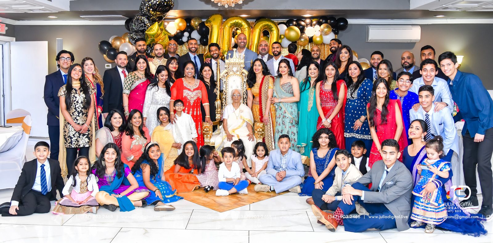 Large family group photo at a 100th birthday celebration