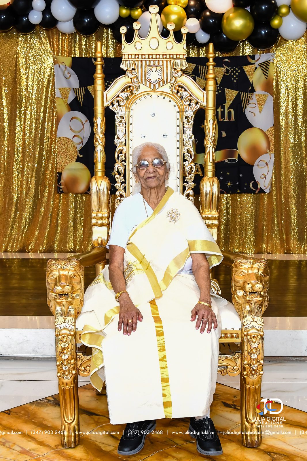 Guest of honor seated on a gold throne at a 100th birthday
