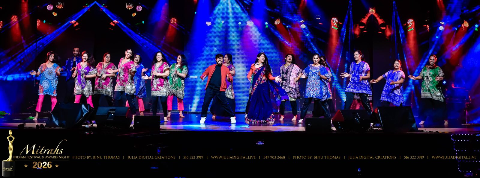 Group dance on a lit stage at an award night