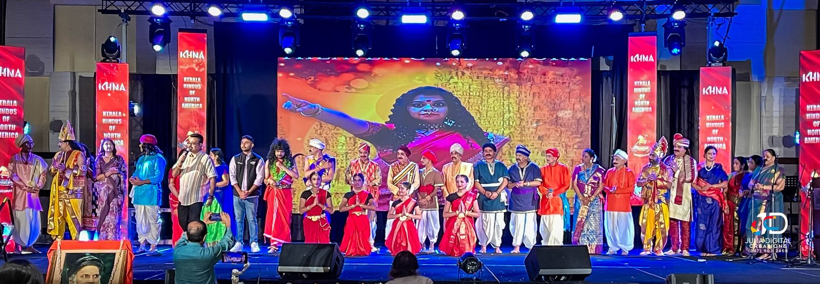 Performers gathered on stage at a cultural event