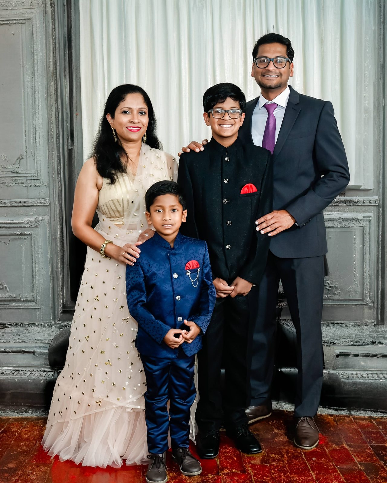 Formal portrait of a family of four