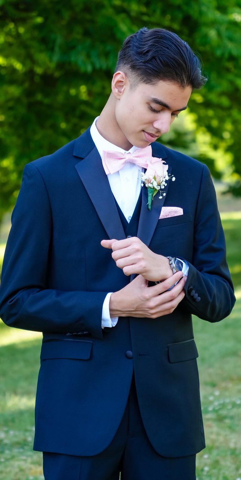 Full-length portrait adjusting his cuff