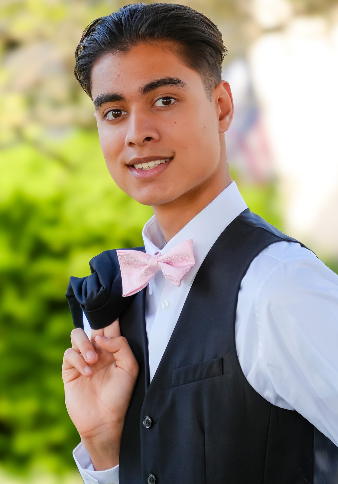 Smiling portrait with pink bow tie